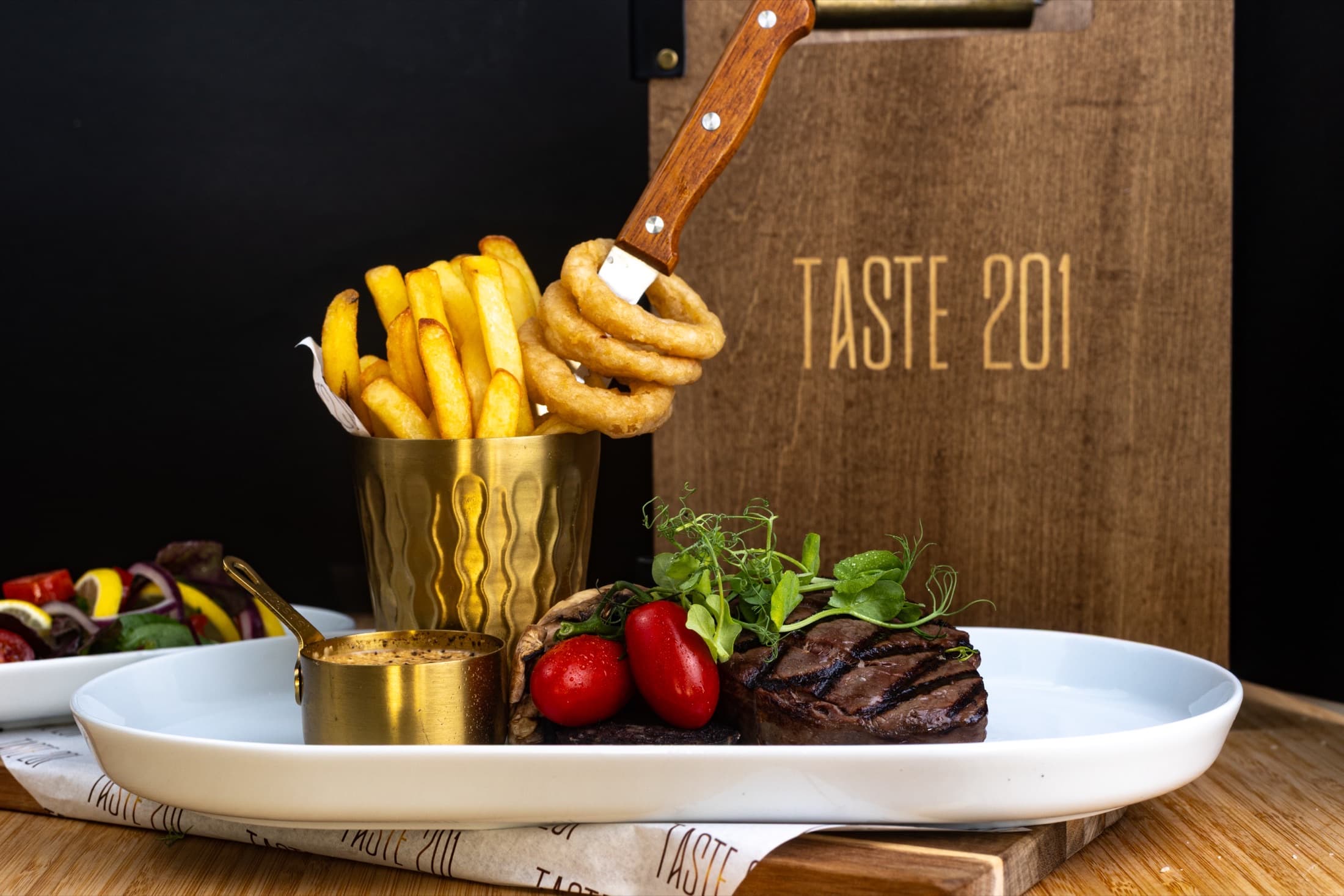 Grilled steak with fries and salad