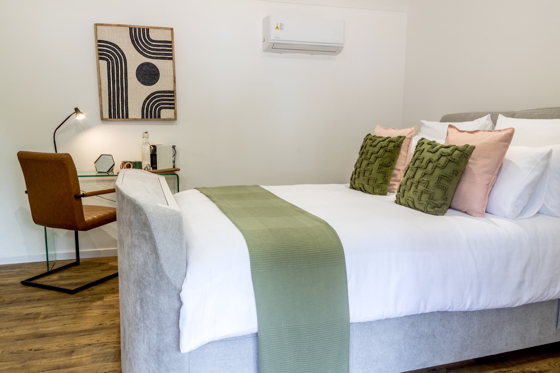 Guest room with bed and workspace